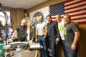 a group of business owners in a radio station